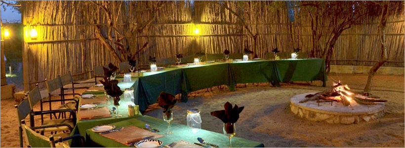 Greenfire Lodge, dining at the end of a gameviewing day, in the traditional boma