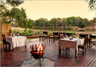 Dining under the night stars alongside a crackling wood fire