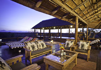 Watching the sun set on the deck at Sausage Tree Safari Camp